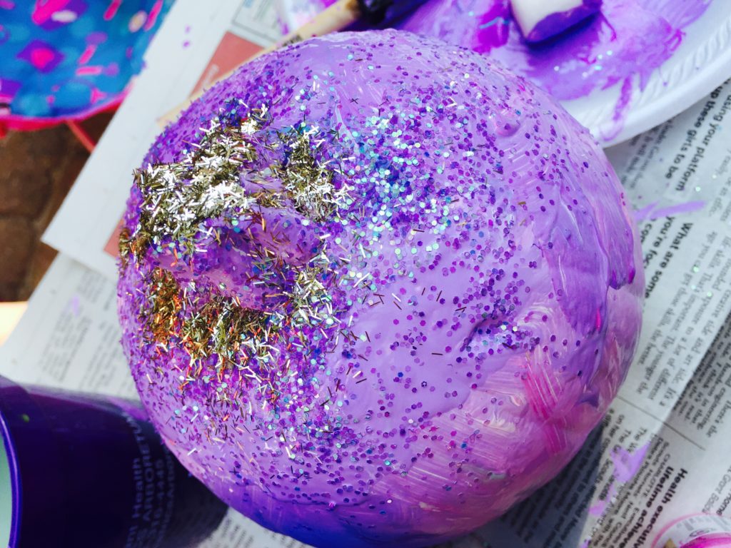 Add glitter to the painted pumpkins to add sparkle