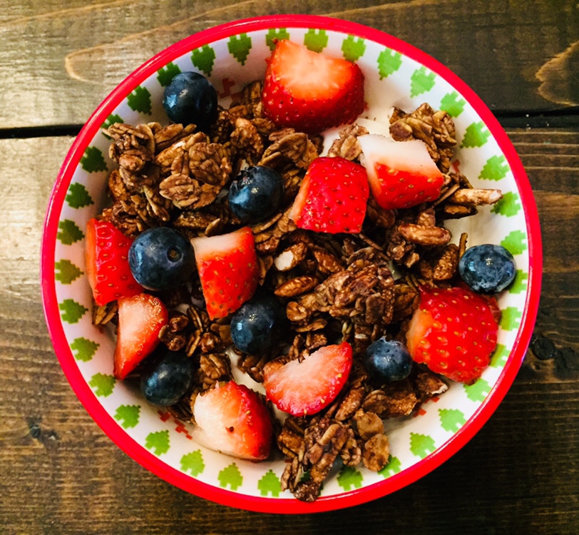 Chocolate granola with yogurt and berries