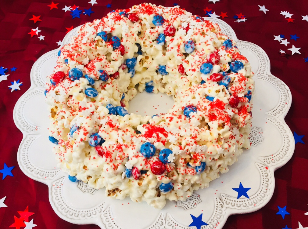 The recipe for Patriotic Popcorn Cake is so simple and perfect to make with kids. You only need a few ingredients and it would be perfect to take to a picnic or 4th of July party!