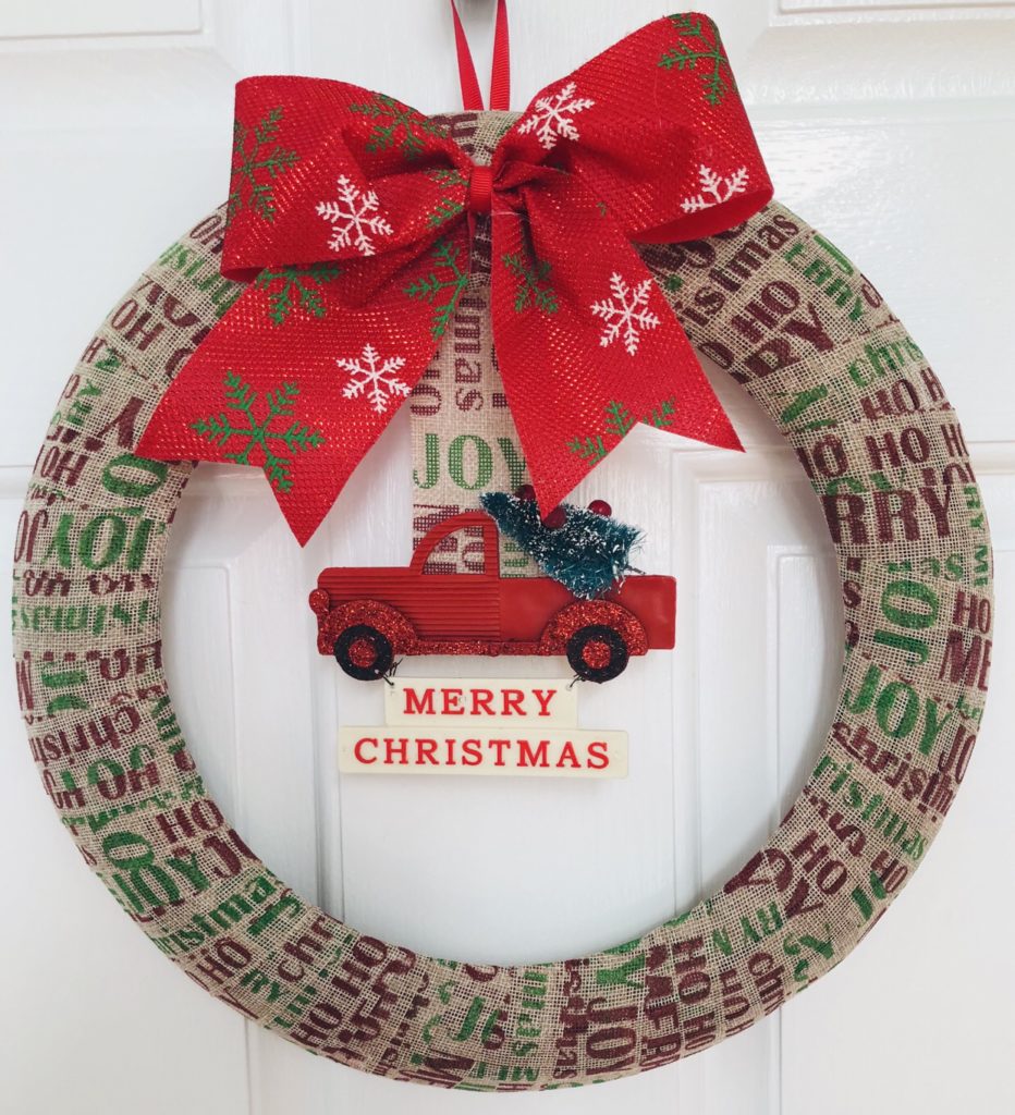 Simple Dollar Tree Christmas Wreath using burlap ribbon and an ornament.