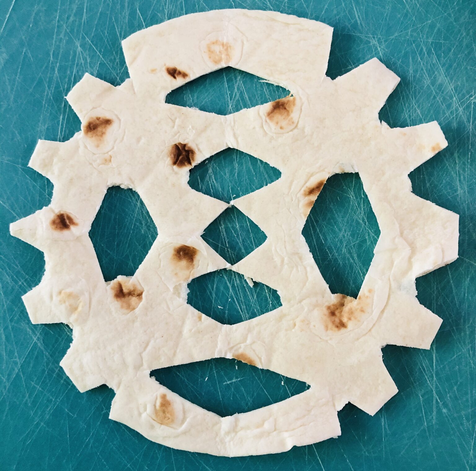 Baked Snowflake Tortillas with Powdered Sugar Glitter On A Dime