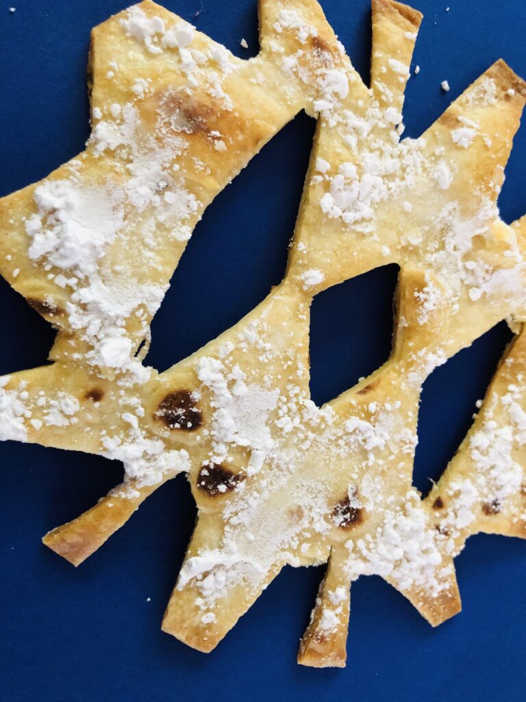 Baked Snowflake Tortillas with Powdered Sugar