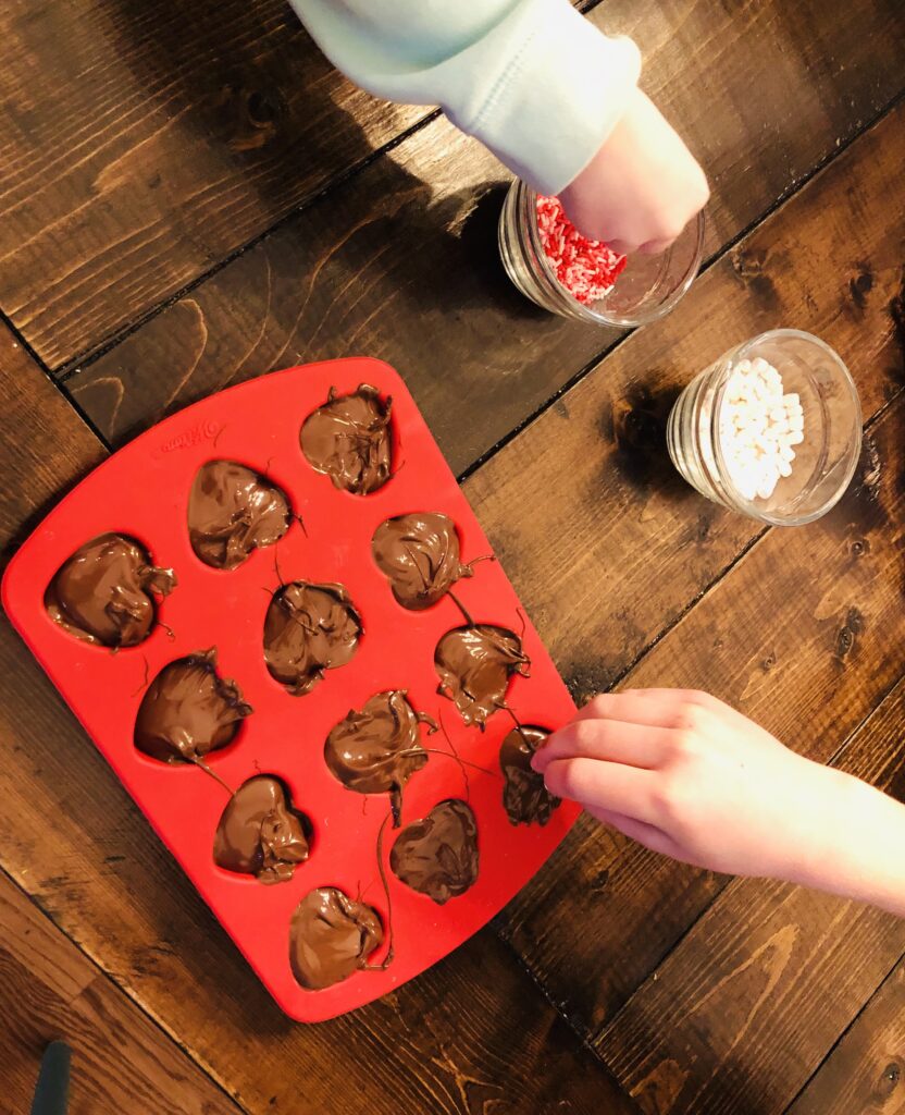 Decorating the hot cocoa stirrers