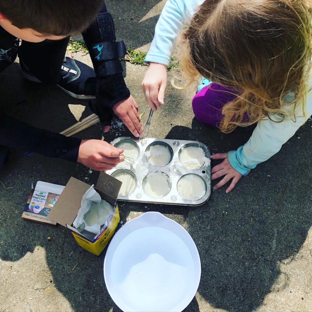 Kids making sidewalk paint