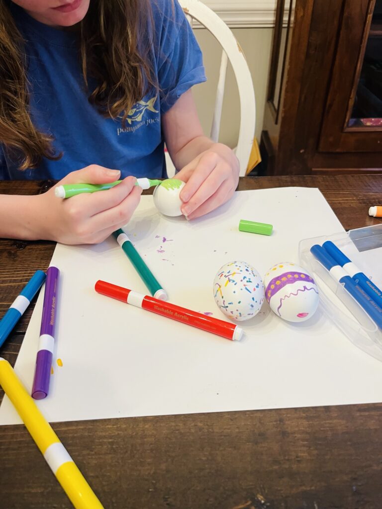 Using acrylic markers to decorate Easter Eggs